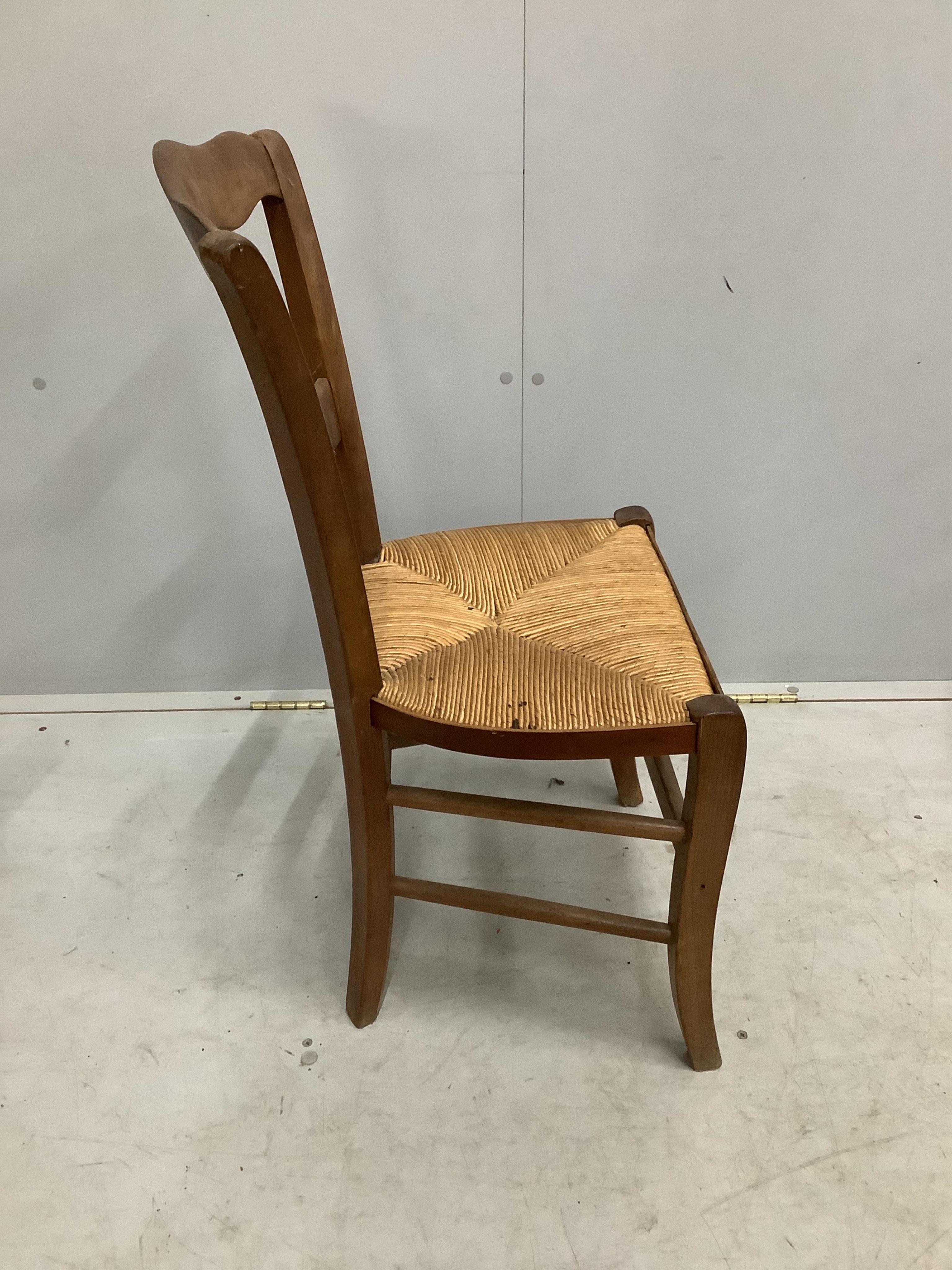 Four French cherry rush seat dining chairs, height 84cm. Condition - fair to good